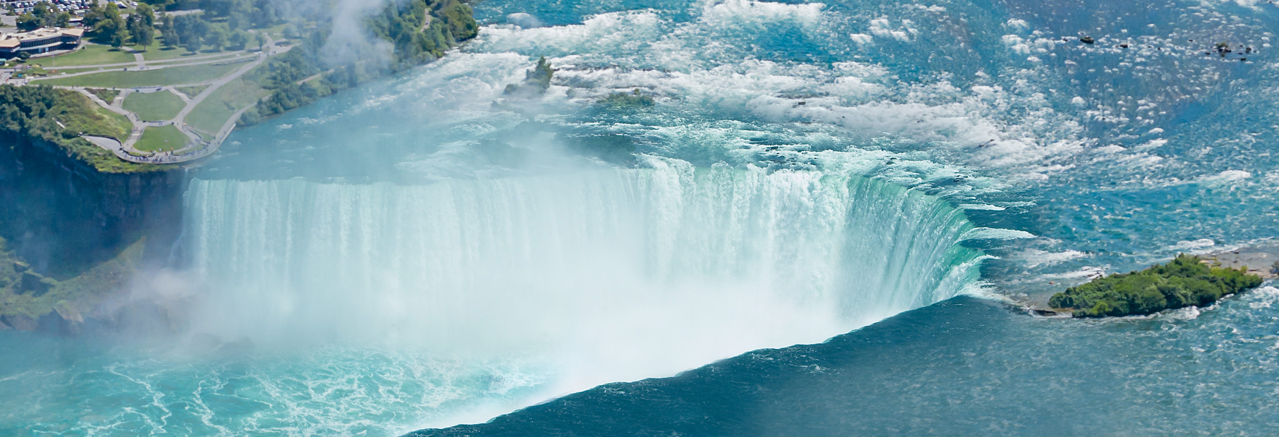 Embassy Suites By Hilton® Fallsview Hotel Horseshoe Falls Background 42-floor Embassy Suites By Hilton® Fallsview Hotel overlooking the famous horseshoe falls in Niagara Falls, Ontario, Canada